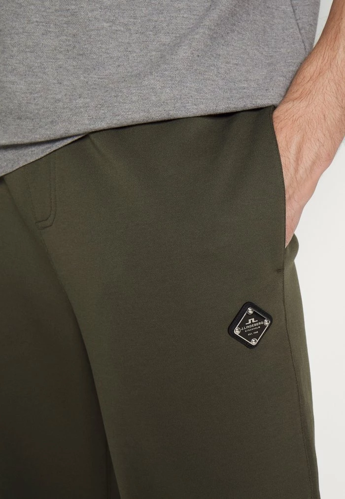 CREED - Tracksuit bottoms - forest green