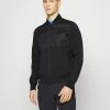 J.LINDEBERG LOGAN HYBRID BOMBER JACKET - Hardshell Jacket - Black