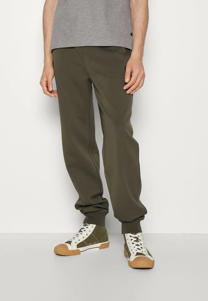CREED - Tracksuit bottoms - forest green