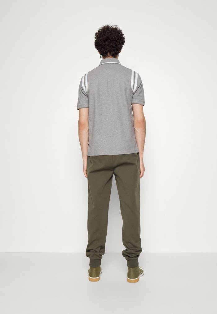 CREED - Tracksuit bottoms - forest green