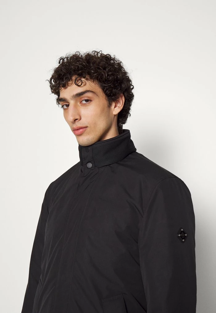HOLLIS TECH PADDED COAT - Classic coat - black