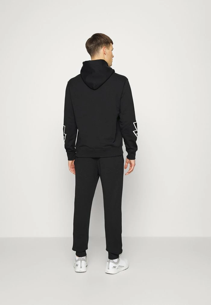 STRIKE - Tracksuit bottoms - black