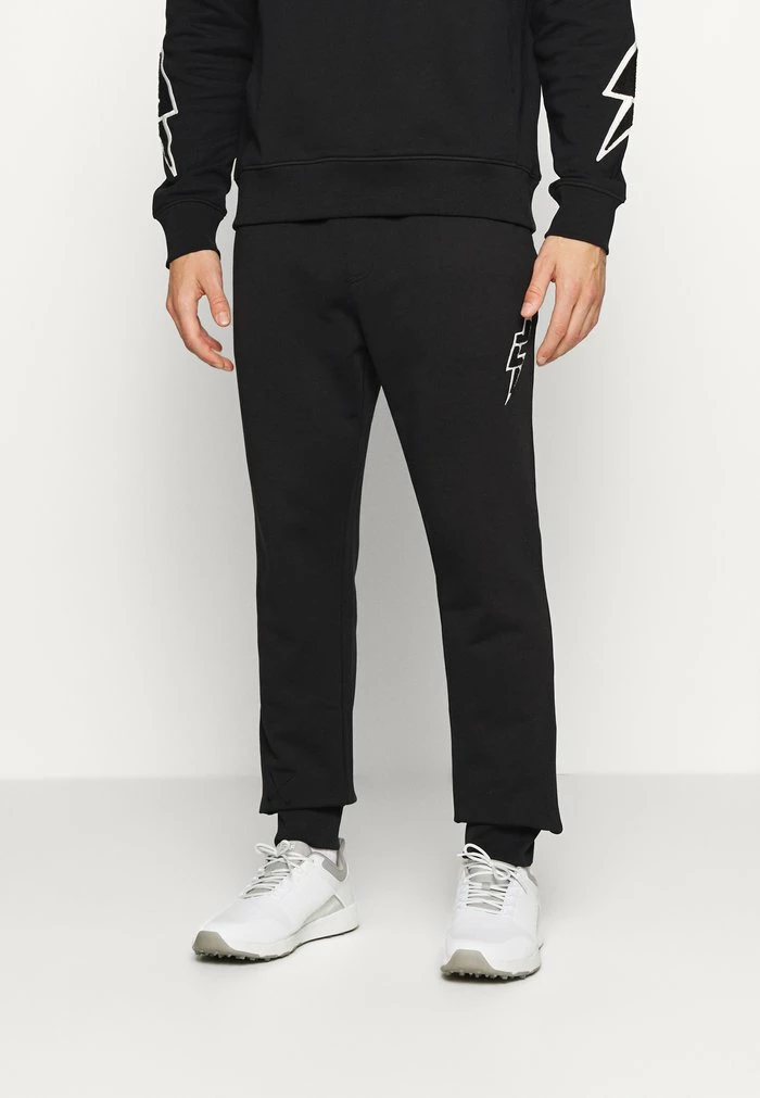 STRIKE - Tracksuit bottoms - black