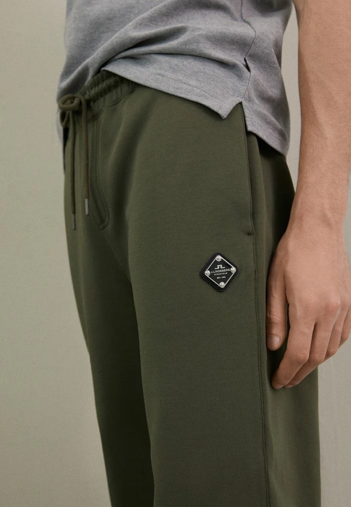 CREED - Tracksuit bottoms - forest green