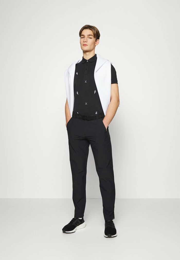 STRIKE - Polo shirt - black